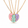 Three pastel Best Friends Forever necklace pendants forming a heart on white; studio-style product illustration