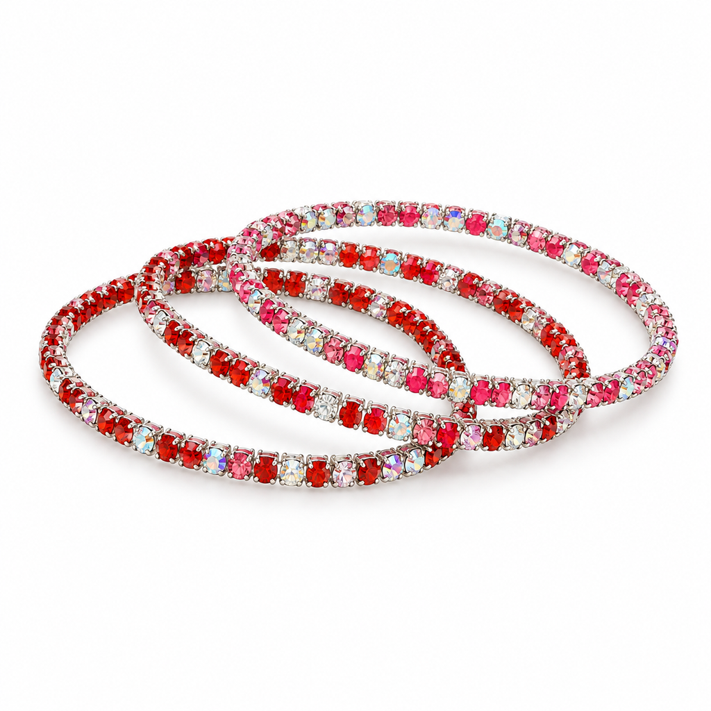 Studio-style illustration of pink and red sparkle bracelets on white
